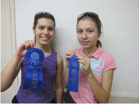 ferg3 Sebrianne and Dina Ferguson of Redwood City show off the awards the girls earned from entering their stamp exhibits at the 2011 Santa Clara County Fair.
